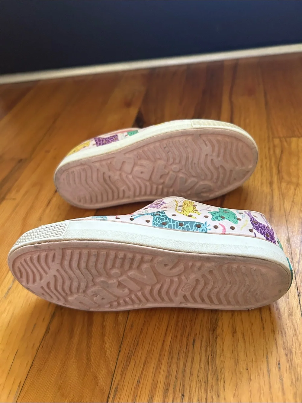 Native Kids White Slip-On Sneakers with Pink Multicolor Dino Print